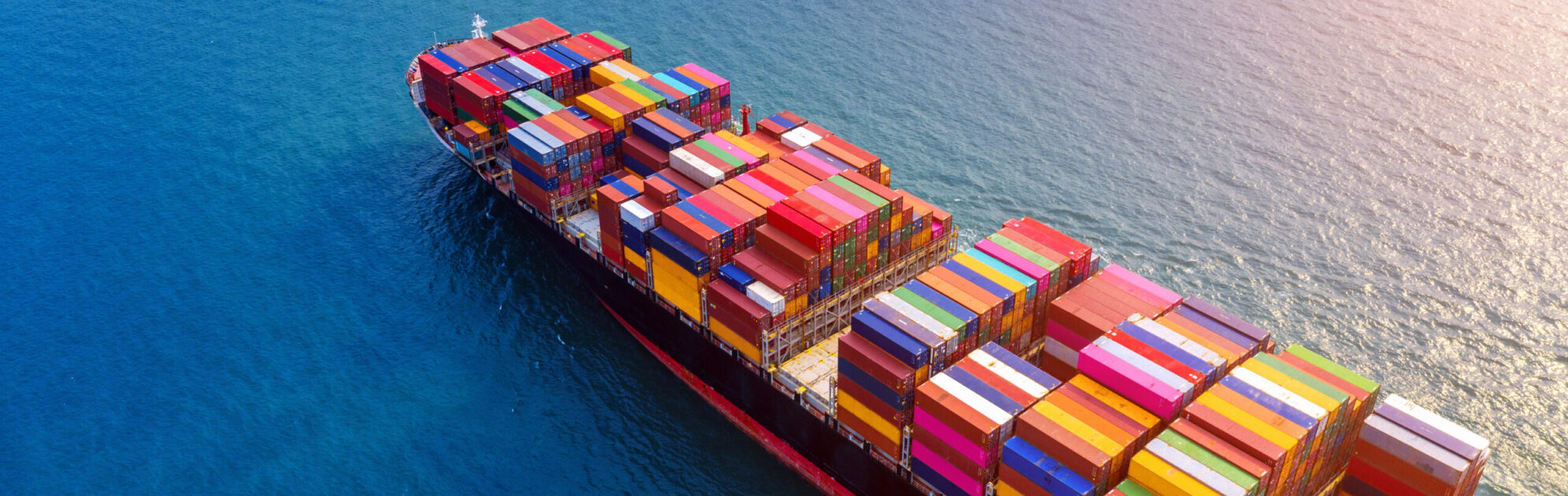 Aerial view of container cargo ship in sea.
